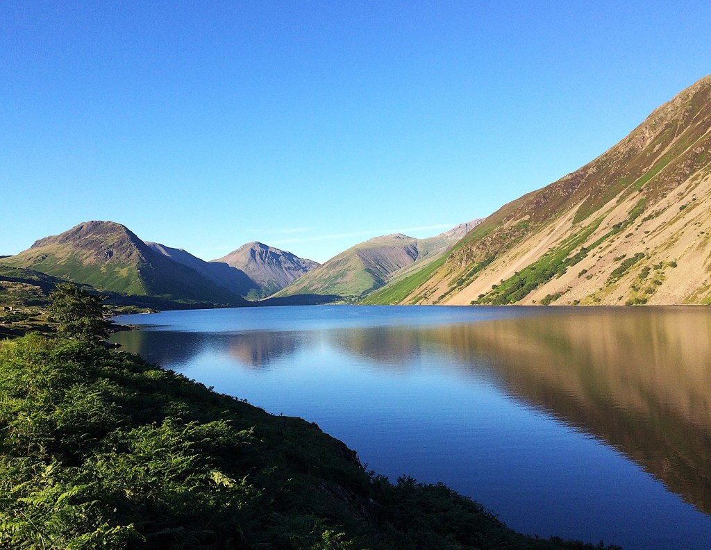 Calm lake scene with mountains reflected in the water
